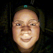 a close up of a person 's face with a mopar logo on her hat