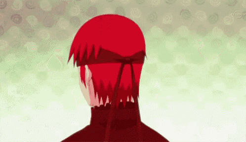 a person with red hair is wearing a headband and a turtleneck .