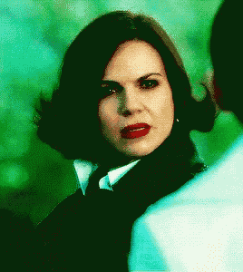 a close up of a woman 's face with red lips