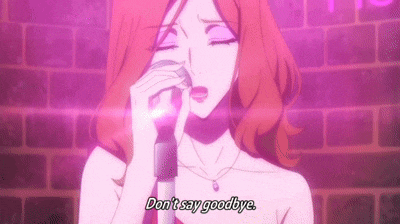 a woman is singing into a microphone in front of a brick wall and says `` don 't say goodbye '' .