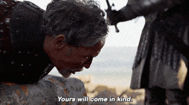 a man is kneeling down and saying " yours will come in kind " to another man
