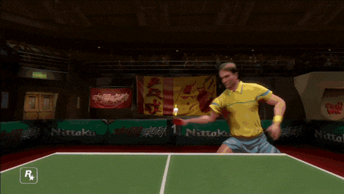 a man is playing ping pong in a video game with a nitto logo in the background