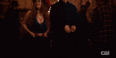 a man in a cowboy hat and a woman in a cowboy hat are standing next to each other