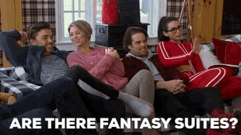 a group of people are sitting on a couch with the words `` are there fantasy suites '' written on the bottom .