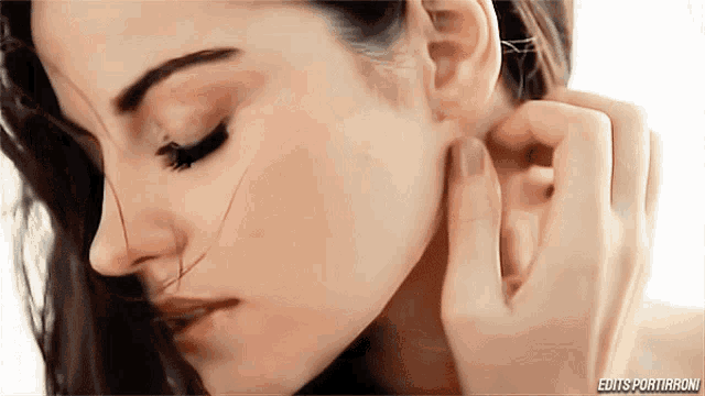 a close up of a woman 's face with the words edits portirroni below her
