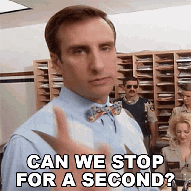 a man wearing a bow tie is asking if we can stop for a second
