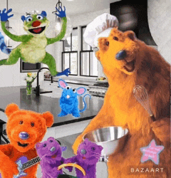 a group of stuffed animals including a frog and a bear are in a kitchen