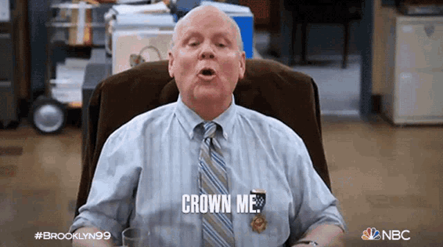 a man in a tie is saying crown me