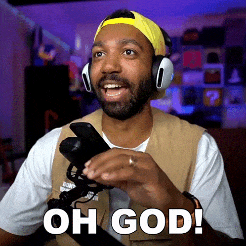 a man wearing headphones is holding a cell phone and says oh god