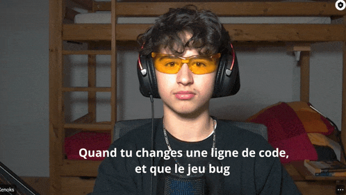 a man wearing headphones and sunglasses says " quand tu changes une ligne de code "