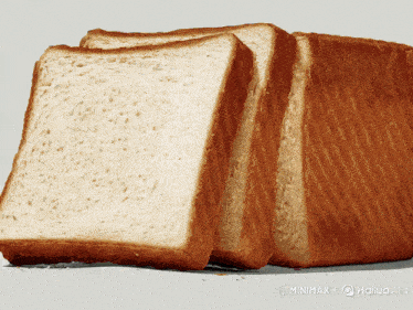 a loaf of bread has been cut into slices and is displayed on a gray background