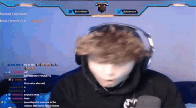 a man wearing headphones is playing a video game