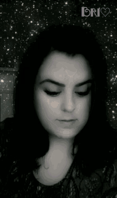 a black and white photo of a woman with the name brio written in purple