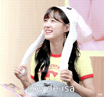 a woman wearing a bunny hat says soy de isa on the bottom right