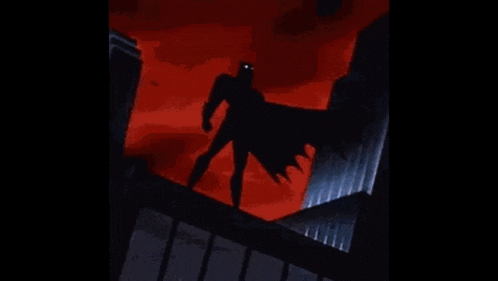 a cartoon of a batman with a yellow face on his head standing on top of a building