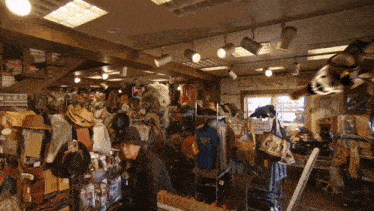 a man in a hat is looking at a texas shirt