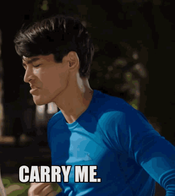 a man in a blue shirt with the words carry me home