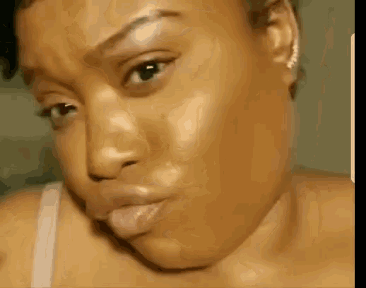 a woman making a funny face with her tongue out