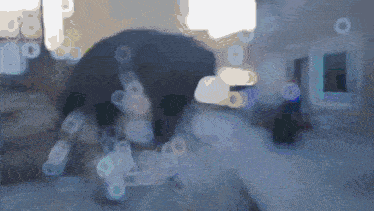 a blurry picture of a person 's face with a blue background