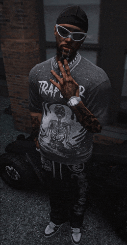 a man wearing sunglasses and a trap t-shirt is smoking a cigarette