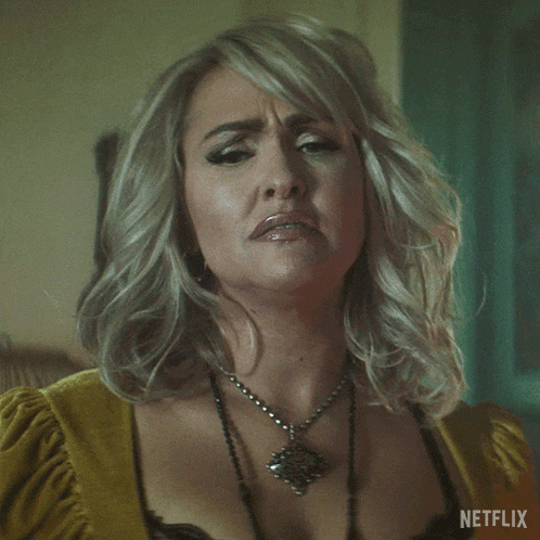 a woman is making a funny face and the word ew is on her face