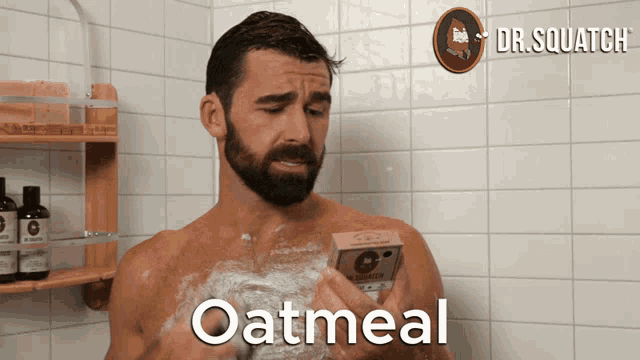 a man taking a shower with a bar of oatmeal soap