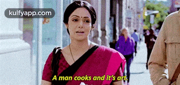 a woman in a red saree says a man cooks and it 's art on the street