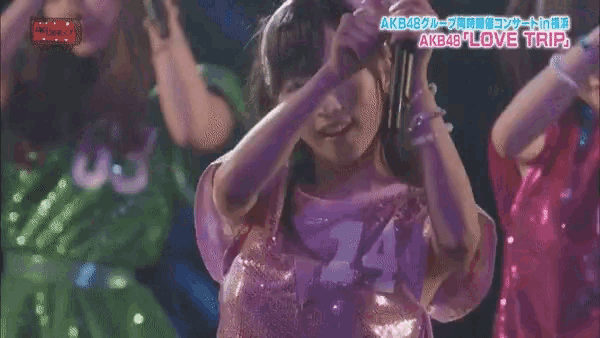 a girl in a pink dress with the number 14 on it