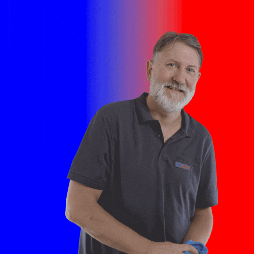 a man with a beard wearing a black shirt with the word bosch on the pocket