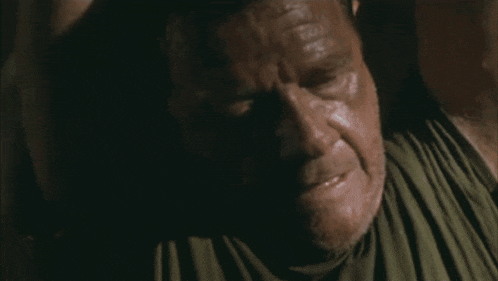 a close up of a man 's face with the words dans ton cul on the bottom