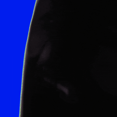 a silhouette of a person 's face is against a yellow background