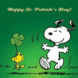 snoopy and woodstock are celebrating st. patrick 's day with a four leaf clover