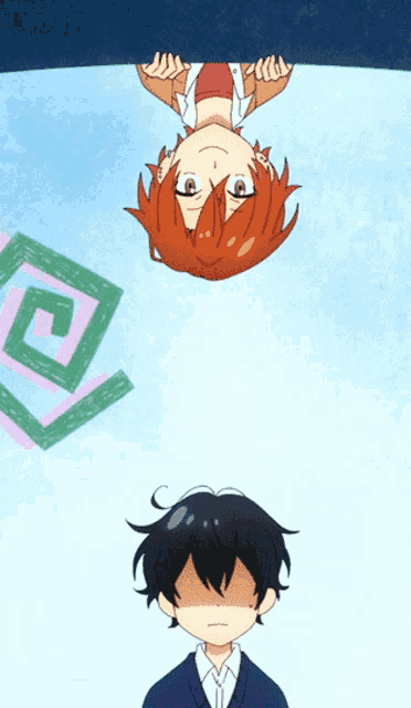 a boy and a girl are upside down and looking down