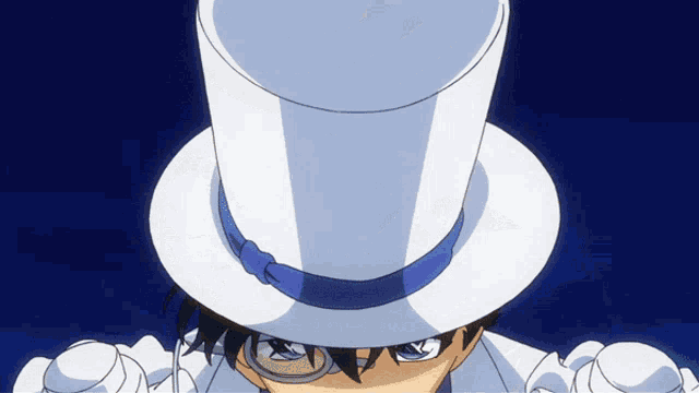 a person wearing a white top hat with a blue band