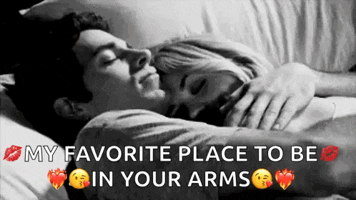 a black and white photo of a man and woman hugging each other .