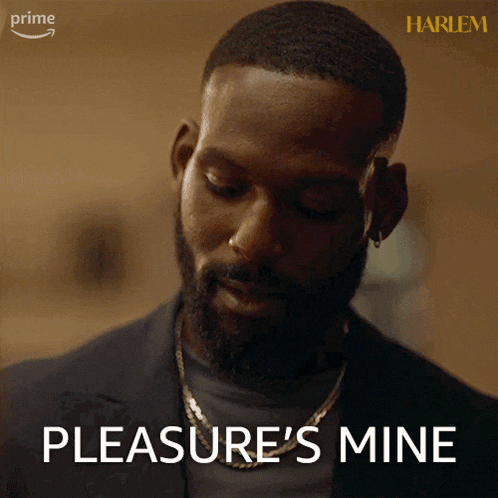 a man with a beard says pleasure 's mine while wearing a necklace
