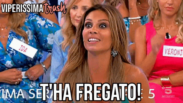 a group of women are sitting in a row and one of them is wearing a name tag that says ida