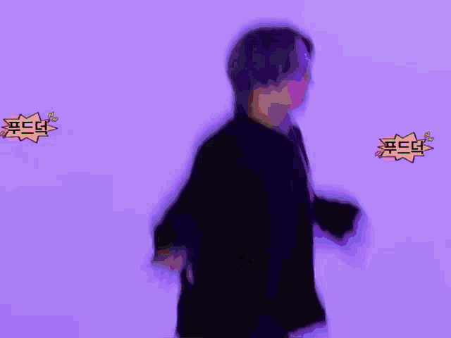 a blurry picture of a man dancing with a purple background