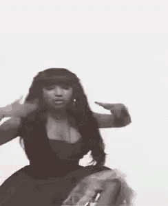 a woman is dancing in a black and white photo .