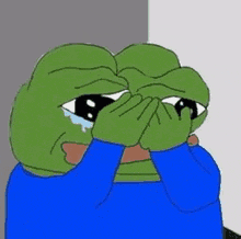 a cartoon frog is covering his face with his hands while crying .