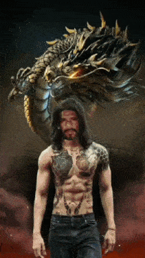 a man with tattoos on his torso is standing in front of a dragon