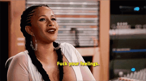 a woman is sitting in a chair and saying fuck your feelings