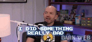 a bald man is sitting in front of a microphone and says i did something really bad dark web