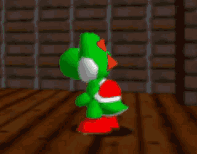a green video game character is standing on a wooden floor in front of a brick wall .