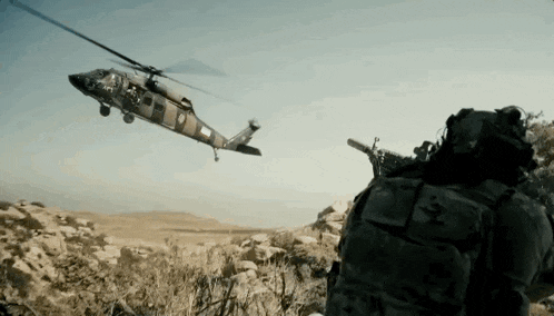 a military helicopter with the number 9 on the side