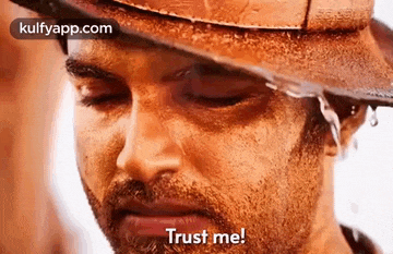 a close up of a man wearing a cowboy hat with water coming out of it and the words `` trust me '' .