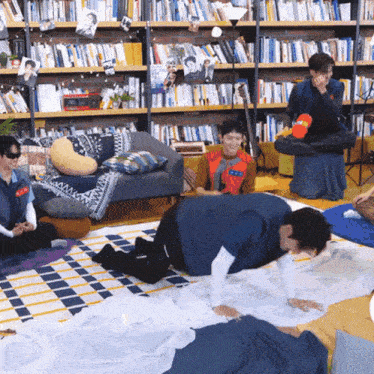 a group of people playing a game in a living room