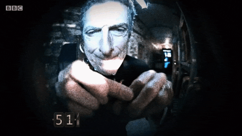 a bbc screen shows a man pointing a gun