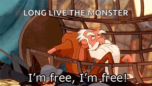 a cartoon of a man in a cage with the words long live the monster i 'm free i 'm free !