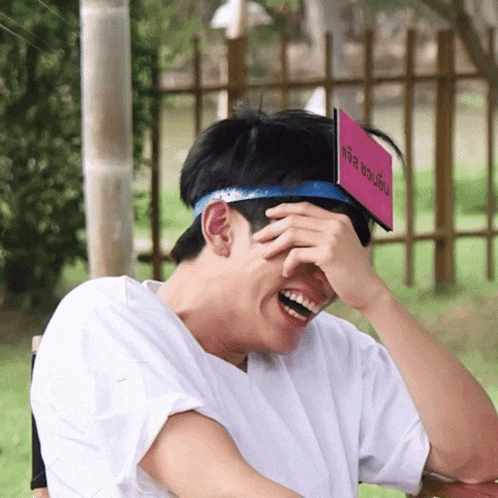 a man with a sign on his head that says ' thailand '